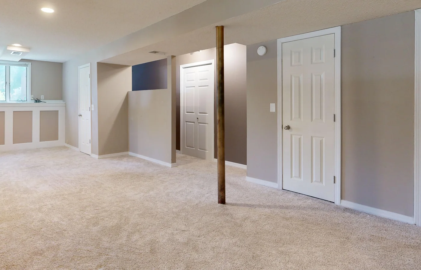 Dry finished basement with carpet and painted walls